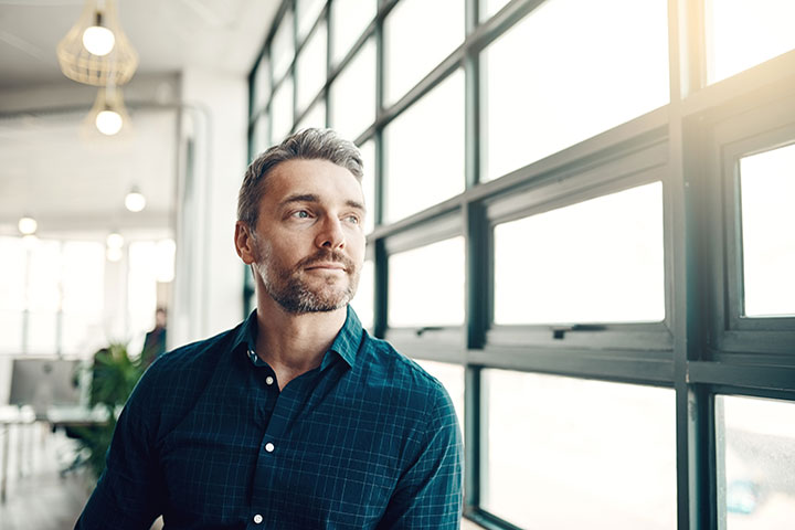 guy looking out window