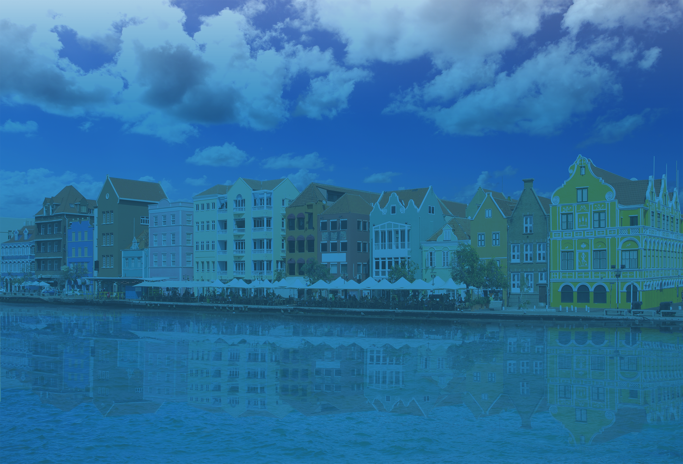 The process of obtaining a Curaçao iGaming license, illustrated by the iconic, colorful waterfront architecture of Willemstad.